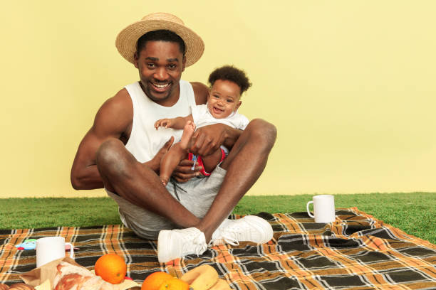 istock Happy family having picnic at studio 1140380420