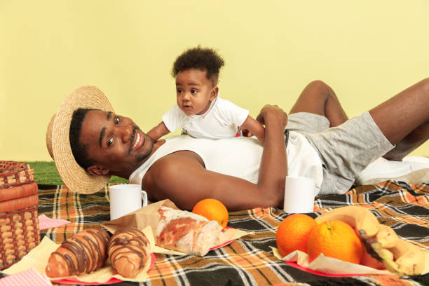 istock Happy family having picnic at studio 1140380422