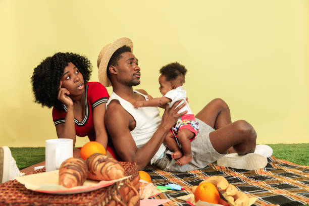 istock Happy family having picnic at studio 1140380423