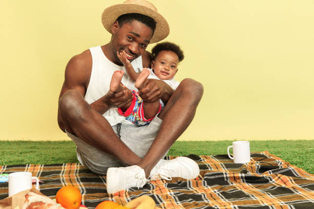 istock Happy family having picnic at studio 1140380424