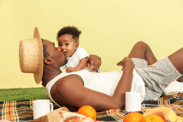 istock Happy family having picnic at studio 1140380425