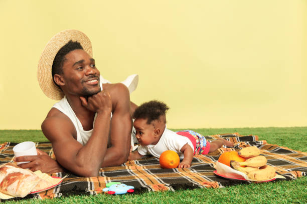 istock Happy family having picnic at studio 1140380426