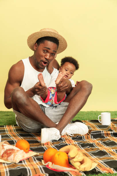 istock Happy family having picnic at studio 1140380427