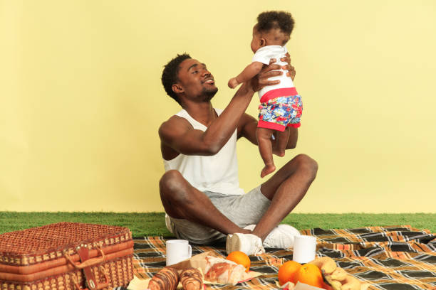 istock Happy family having picnic at studio 1140380435