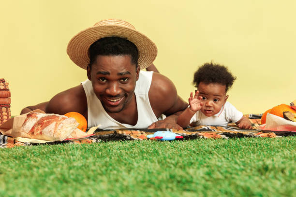 istock Happy family having picnic at studio 1140380438