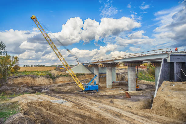istock Lifting crane on the construction of the bridge 1140383362