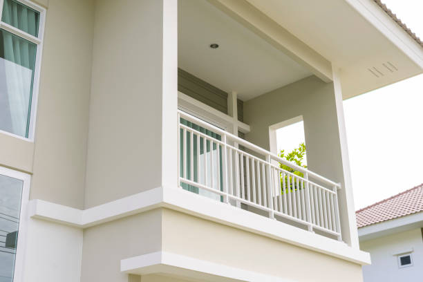 Modern house with balcony terrace, roof gutter system and roof.