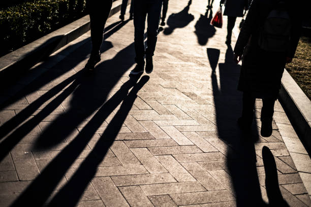 istock Shadows of People in an Avenue 1140384199