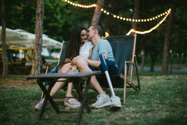 istock Romantic man with amputee leg kissing girlfriend 1140384205