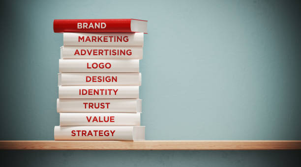전면 회색 벽에 광고 및 브랜딩 책 - branding marketing strategy business 뉴스 사진 이미지