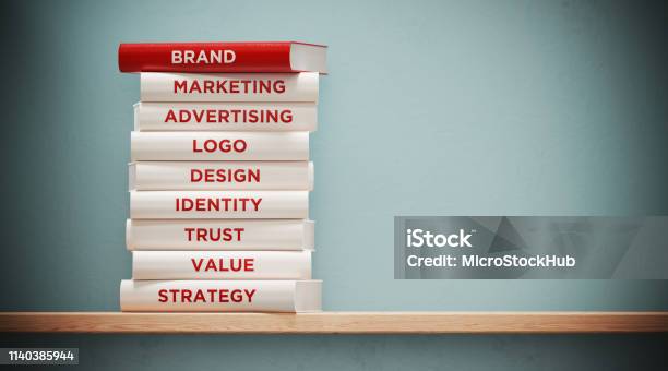 Books Of Advertising And Branding In Front Grey Wall Stock Photo - Download Image Now