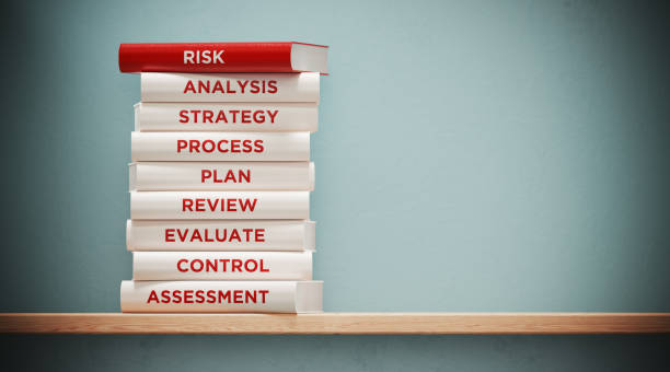 istock Books of  Risk And Analysis In Front Grey Wall 1140386702