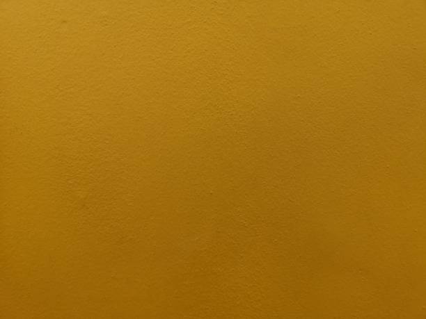 istock Yellow color​ paint​ on​ cement​ wall​ rough​ surface​ texture​ concret​ material​ background 1140387084