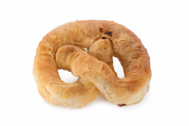 istock Pastry, shaped pretzel puff pastry with curd, isolated on white background. 1140387510