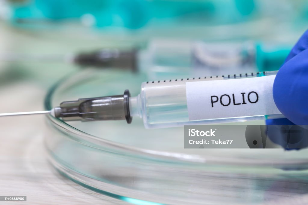 polio vaccination syringe background Polio Stock Photo