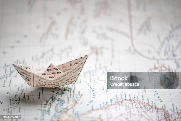 Origami Travel Concepts Ship On Map Stock Photo - Download Image Now - Book, Travel, Map