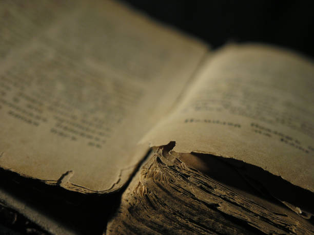 istock Old book isolated over a black background. 1140389644