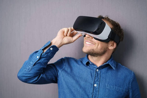 istock One man wearing pair of virtual reality glasses 1140391225