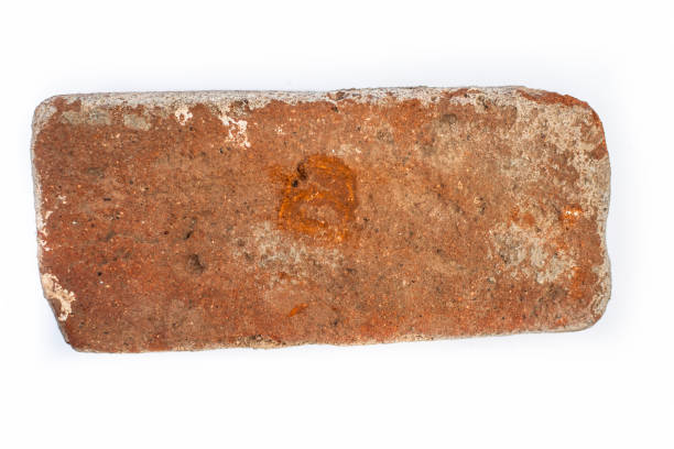 istock Close up of brown colored brick isolated on white. 1140391608