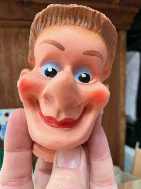 istock Finger punch puppet, young cheeky boy 1140391723