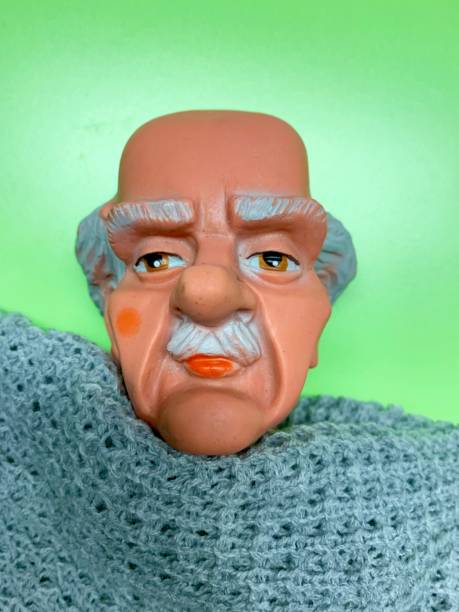 istock Grandfather headshot on green background 1140392272