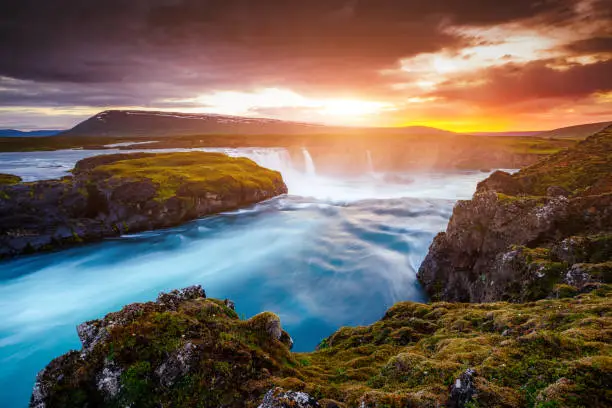 Photo of Great rapid flow of water powerful Godafoss cascade. Location place Bardardalur valley, Skjalfandafljot river, Iceland, Europe.