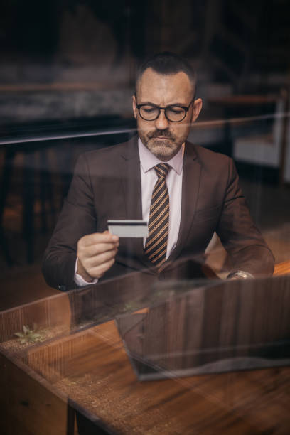 istock Senior businessman paying online on laptop 1140396026