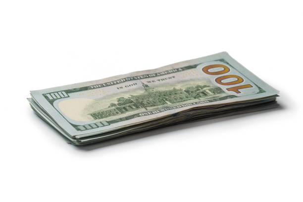 istock Many dollar banknotes on white background. National American currency 1140396614
