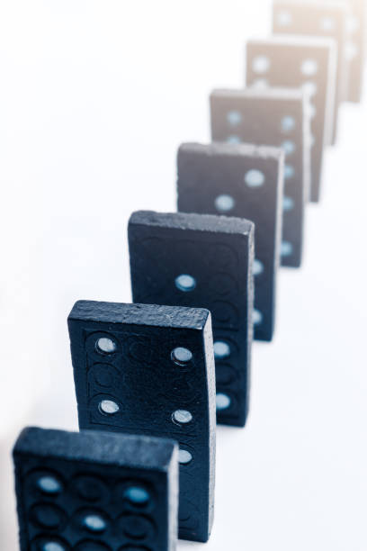 A group of black dominoes lined up A group of black dominoes lined up action plan three dimensional shape people stock pictures, royalty-free photos & images