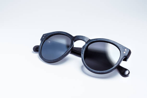 A pair of vintage and fashionable sunglasses isolated on a white background stock photo