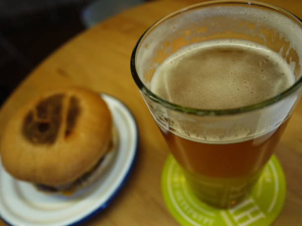 istock A glass of beer and a hamburger. 1140399079