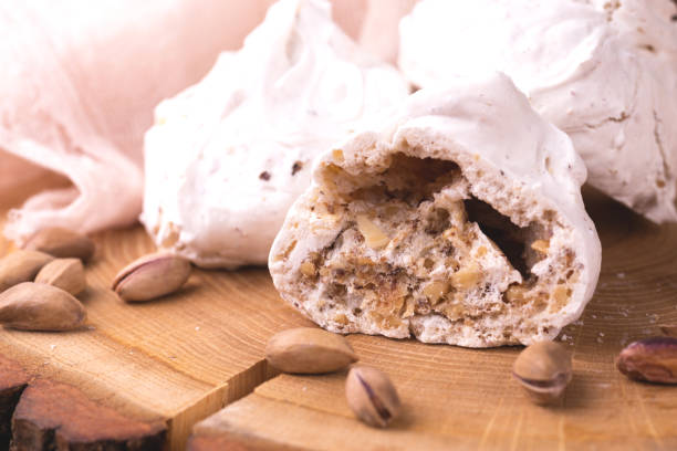 istock dessert. French meringues with nuts, pistachios 1140404890