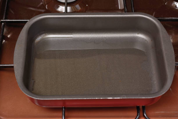 istock Empty baking sheet prepared for roasting on the gas stove 1140407009