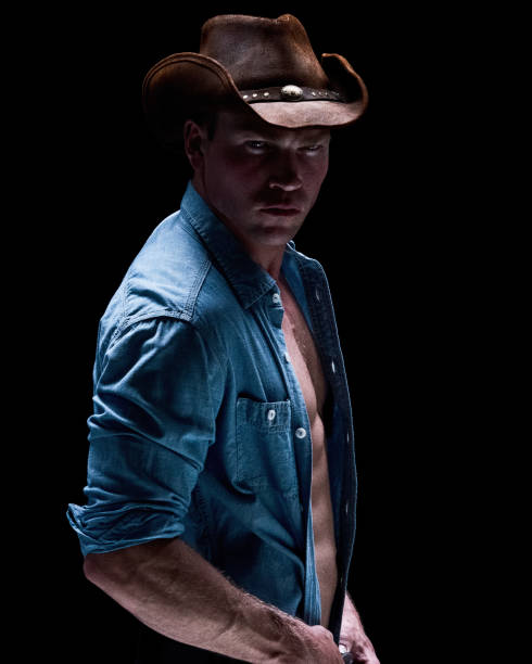 istock Cowboy posing in a sexy manner 1140407945
