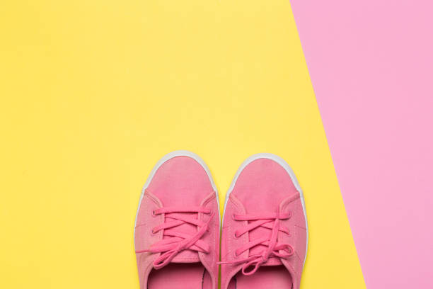 istock Pink shoes on a pastel background. Top view. Free space for text. 1140408085