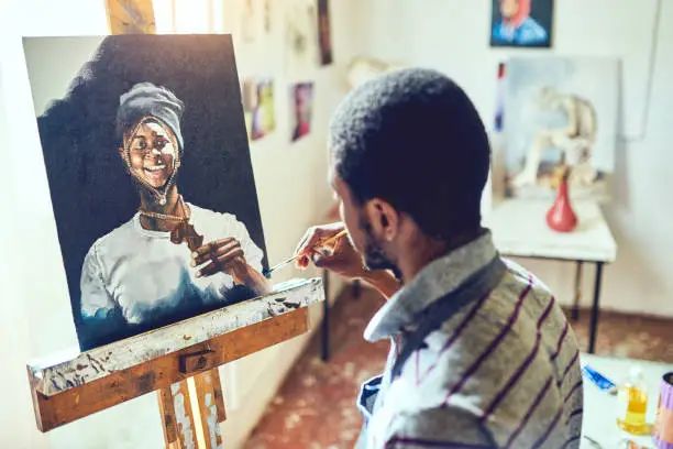 Shot of a young male artist working in his studio