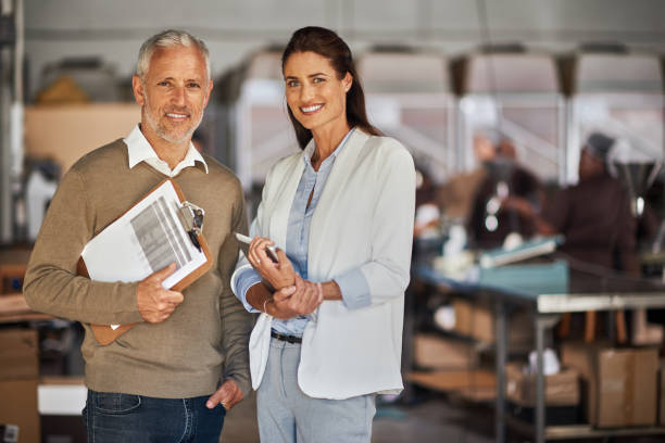 istock Business Colleagues Working In Warehouse 1140412380