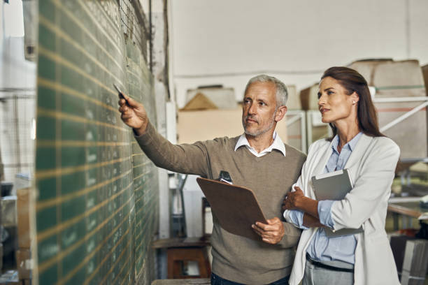 istock Business Colleagues Working In Warehouse 1140412400