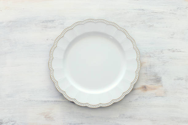 istock Top view of vintage white empty plate. Flat lay 1140413308