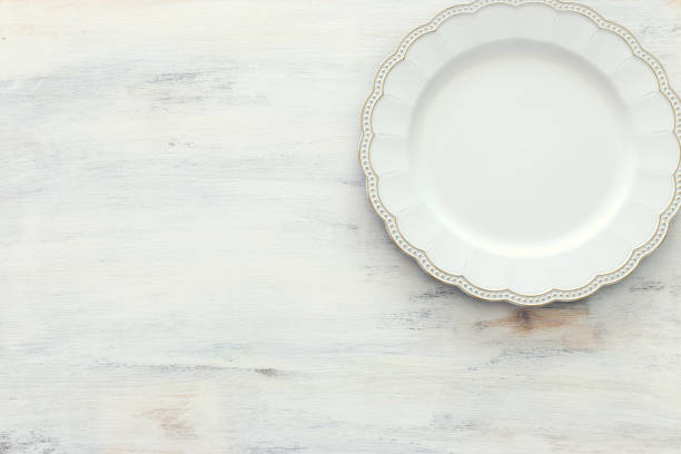 istock Top view of vintage white empty plate. Flat lay 1140413319