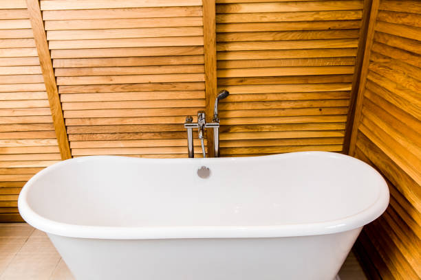 istock Bathroom with bath, shower and wooden backgrounds 1140415255