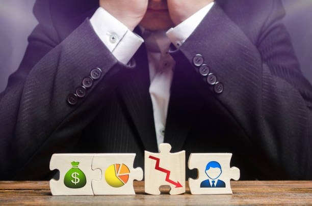 istock A businessman sits in despair and covers his face with his hands. Wrong business model, unprofitability and inefficiency. Failed project, failure and disappointment. Young inexperienced businessman 1140415655