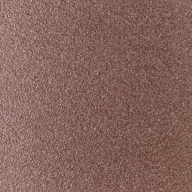 istock Background texture of a shiny metal sheet with a rough stippled textured surface reflecting light. Metal texture 1140415866