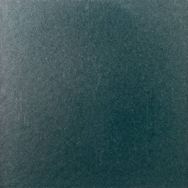 istock Background texture of a shiny metal sheet with a rough stippled textured surface reflecting light. Metal texture 1140416931