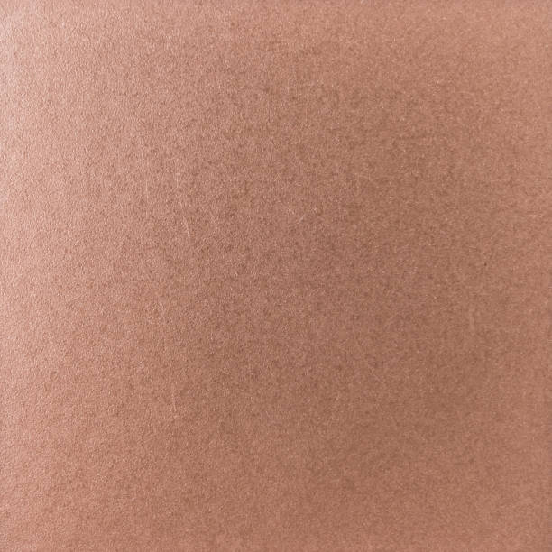 istock Background texture of a shiny metal sheet with a rough stippled textured surface reflecting light. Metal texture 1140416935
