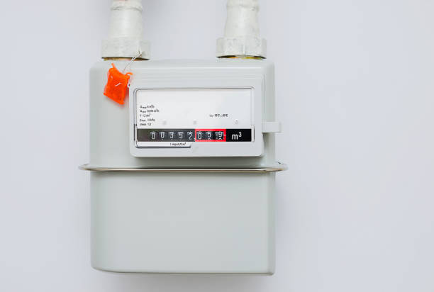 istock A household natural gas meter on the white wall. Selective focus, close-up. 1140419655