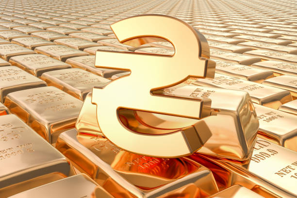 istock Background from gold ingots with Ukrainian hryvnia symbol, 3D rendering 1140420385