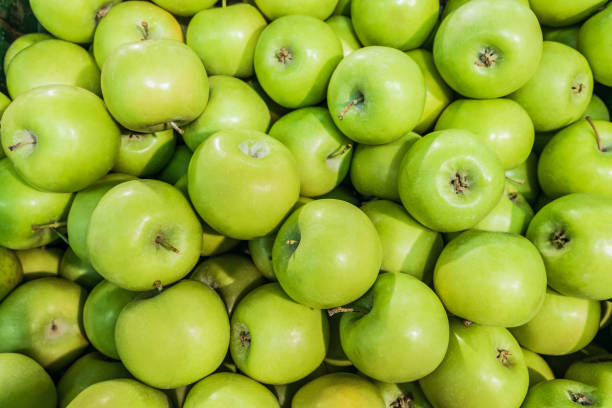 istock Granny smith  green apples. Raw fruit background. Top view. 1140430034