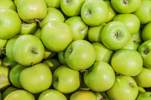 istock Granny smith  green apples. Raw fruit background. Top view. 1140430035