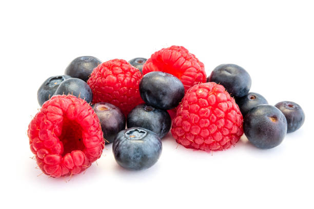 istock raspberries and blueberries isolated on white background 1140430811